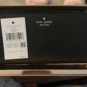 Brand new Kate Spade zip black glimmer wallet.